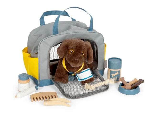 Hund mit Tasche und Pflege-Set