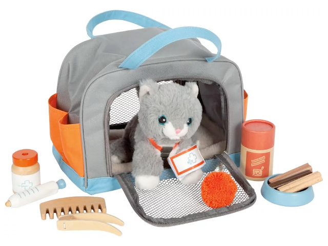Katze mit Tasche und Pflege-Set